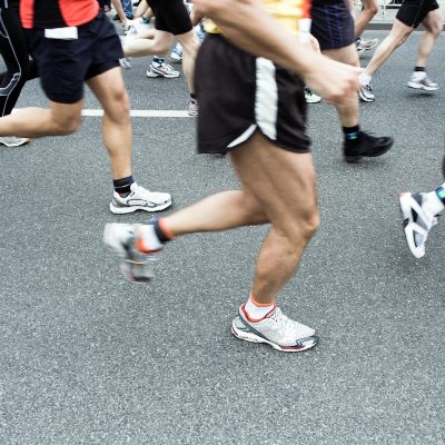 Runners running in city marathon
